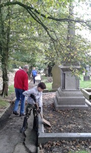 Volunteers tidy the grave of Sir W.P.Hartley